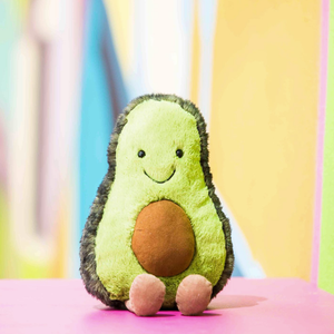 Avocado plush toy with a smiley face