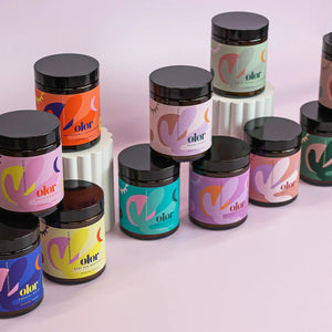 Scented candles in glass jars with colourful illustrations