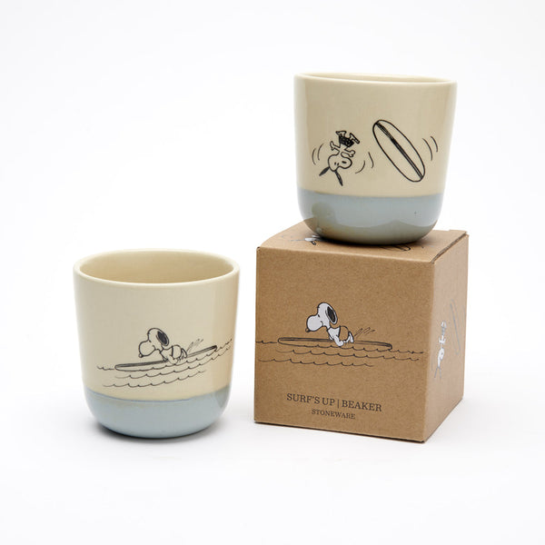 natural colour stoneware beaker with blue glaze bottom and surfing snoopy illustration on both sides, and kraft gift box