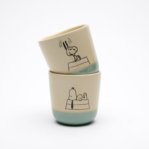 natural coloured stoneware beaker with blue glazed bottom, with snoopy on roof illustration