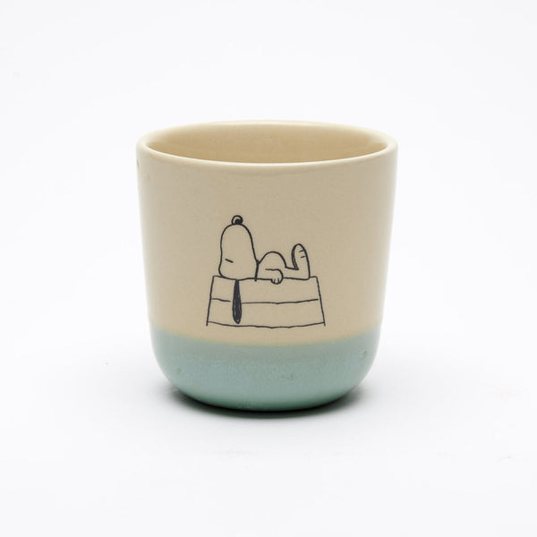 natural coloured stoneware beaker with blue glazed bottom, with snoopy on roof illustration