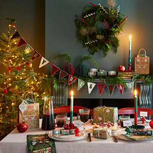 Party table with colourful gingham party hats and napkins