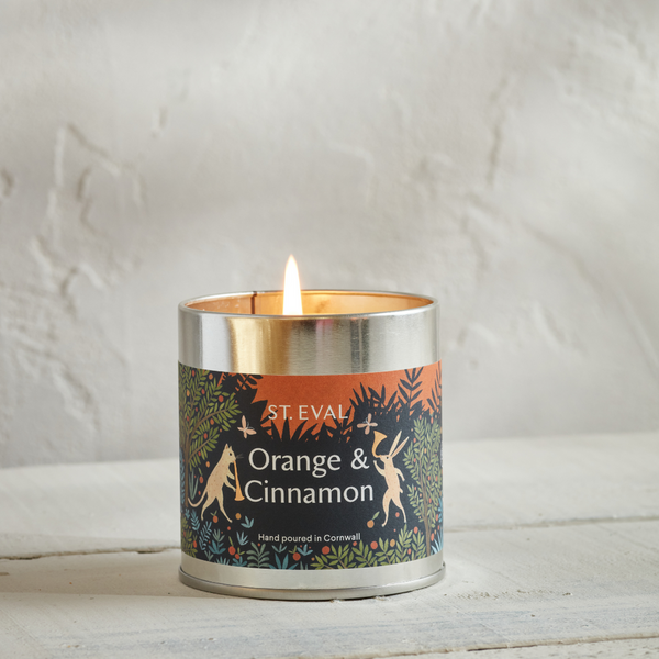 Orange & Cinnamon scented candle in a silver tin with christmas design label