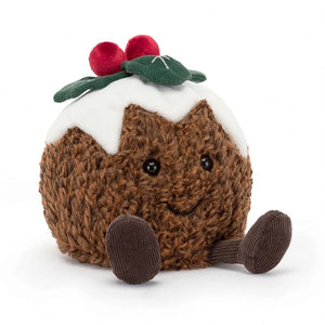 Soft fur christmas pudding cuddly plush toy with velour icing and cord holly leaves, with smiley face and little legs 