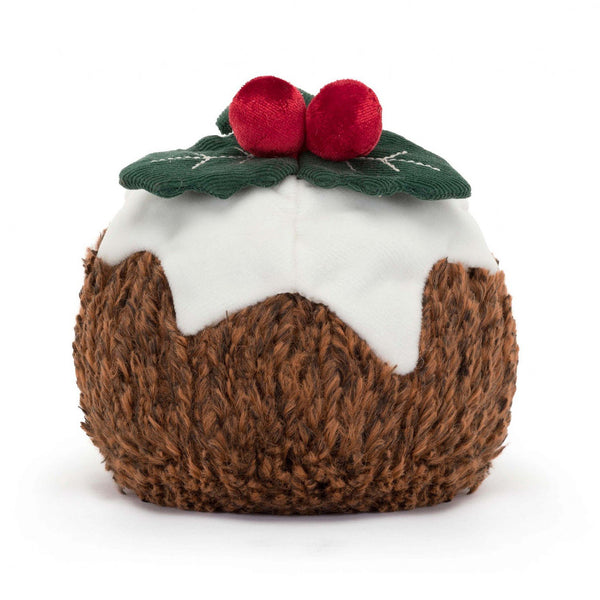 Soft fur christmas pudding cuddly plush toy with velour icing and cord holly leaves, with smiley face and little legs