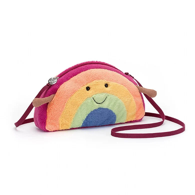 Crossbody bag in ranbow shape with smiley face and little arm. Colourful soft fleece faux fur and corduroy. Cuddly plush bag with zip closure and straps.