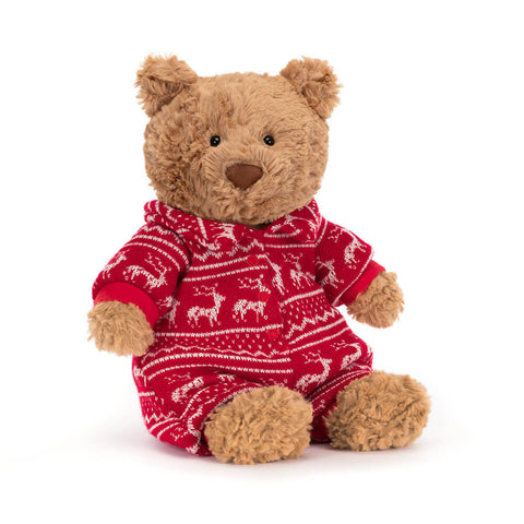 brown teddy bear plush toy wearing red and white winter onesie pyajama 