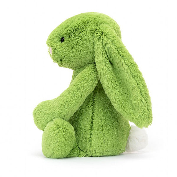Soft faux fur bunny rabbit doll in apple green with white pompom tail. Cuddly plush toy. 