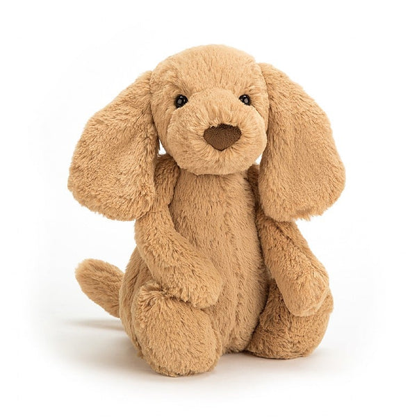 Soft faux fur beig dog doll with floppy ears and beady eyes.