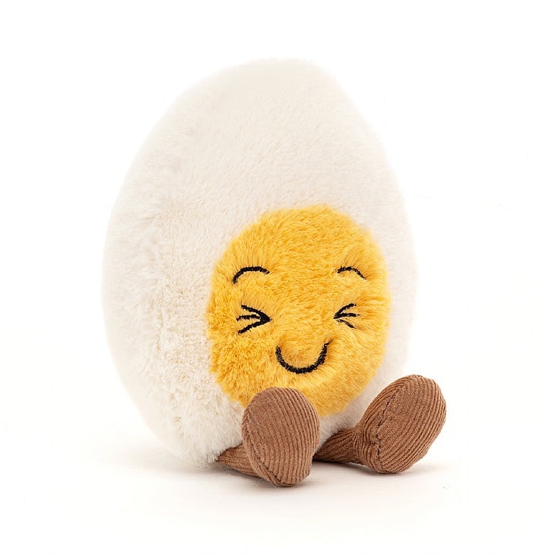 Soft fur oiled egg cuddly plush toy with laughing face and brown cord legs