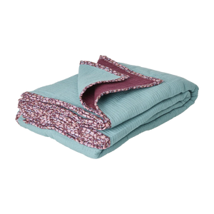 soft cotton muslin blanket in light blue and aubergine with floral print edges