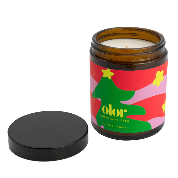 Scented candle in brown jar with colourful christmas tree label