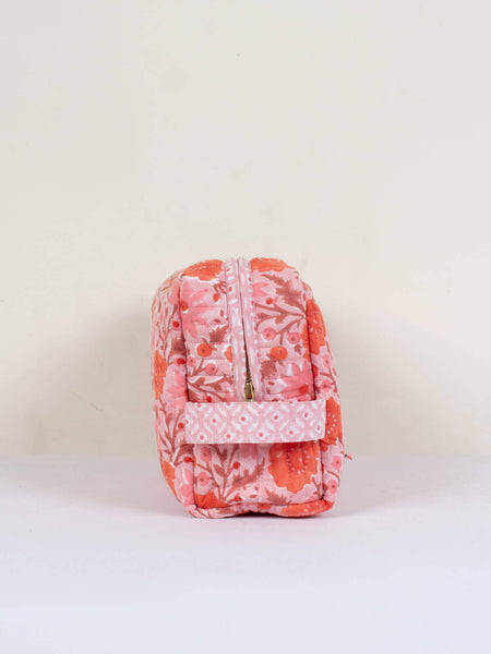 quilted cotton wash bag in pink with red and pink flower print