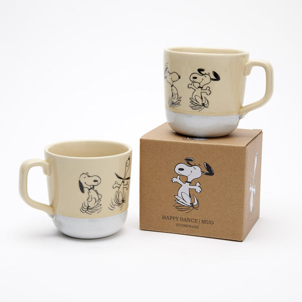 Natural colour stoneware mug with light white glaze at bottom and happy dancing snoopy illustration, kraft gift box