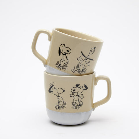 Natural colour stoneware mug with light white glaze at bottom and happy dancing snoopy illustration