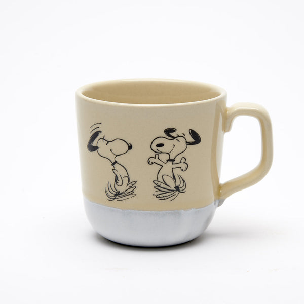 Natural colour stoneware mug with light white glaze at bottom and happy dancing snoopy illustration