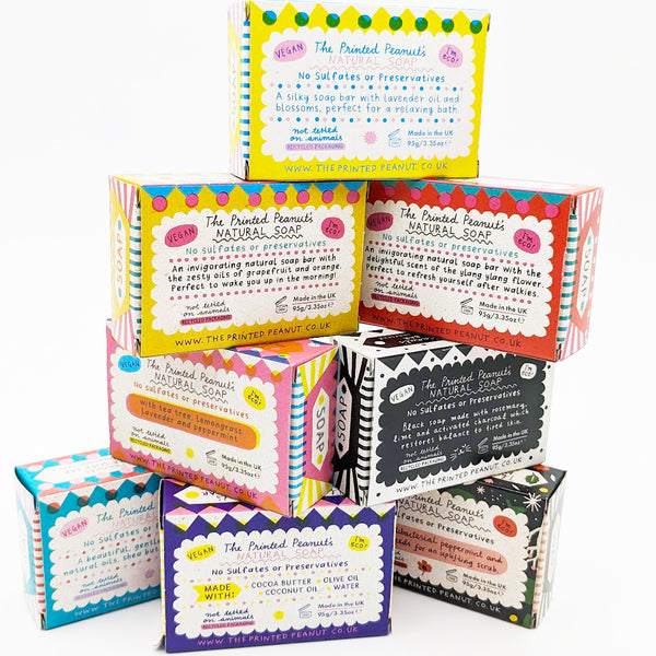 Stack of natural soap bars with colourful illustrations