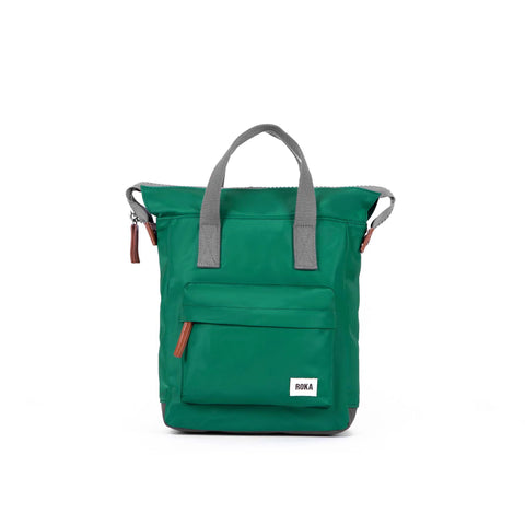 Emerald green nylon backpack with grey carry handle and large pocket 