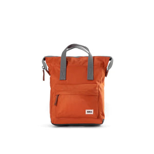 Orange nylon backack with grey carry handel and large pocket