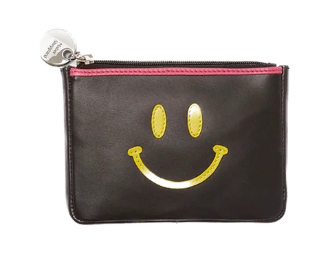 black leather purse with yellow smiley face and pink tape accent
