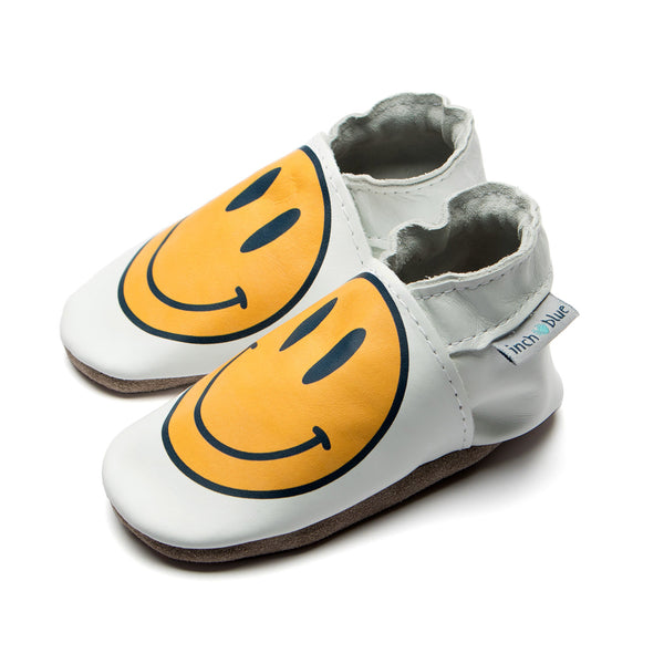 Handmade baby shoes with smiley print in yellow and white