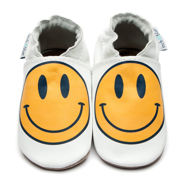 Handmade baby shoes with smiley print in yellow and white