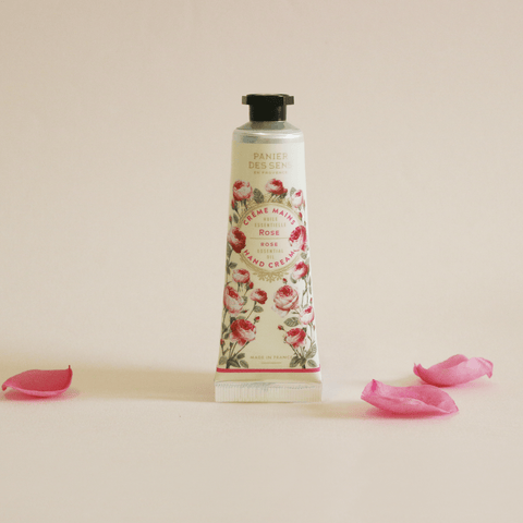 Rose hand cream in a silver tube with rose illustration and black lid