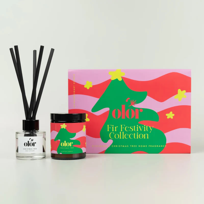 A set of christmas tree scented candle and reed diffuser in a box with Christmas tree illustration