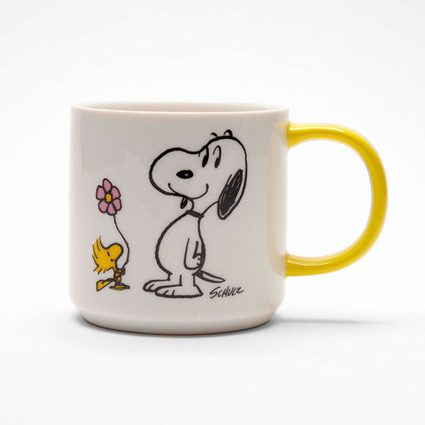 white ceramic mug with snoopy and woodstock, with yellow handle