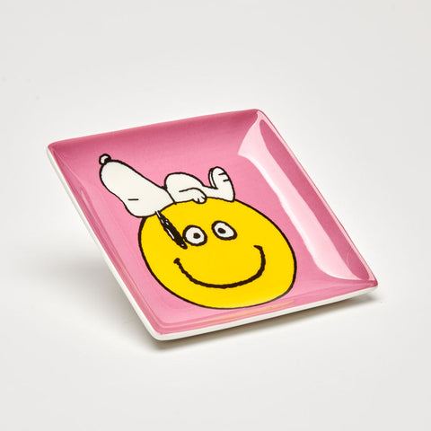 Pink square ceramic trinket tray with snoopy on a smile face illustration