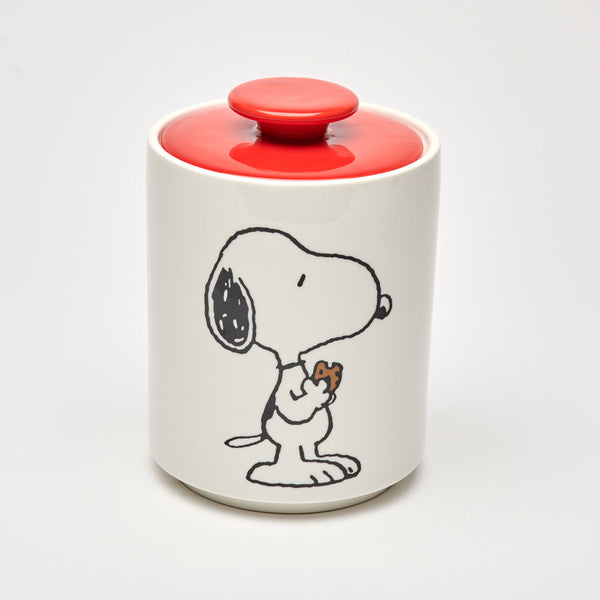 white ceramic cookie jar with peanuts snoopy illustration and red lid