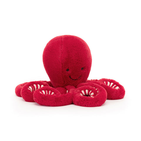 Bright cramberry red octopus plush toy with smiley face, red and white stripe on legs 