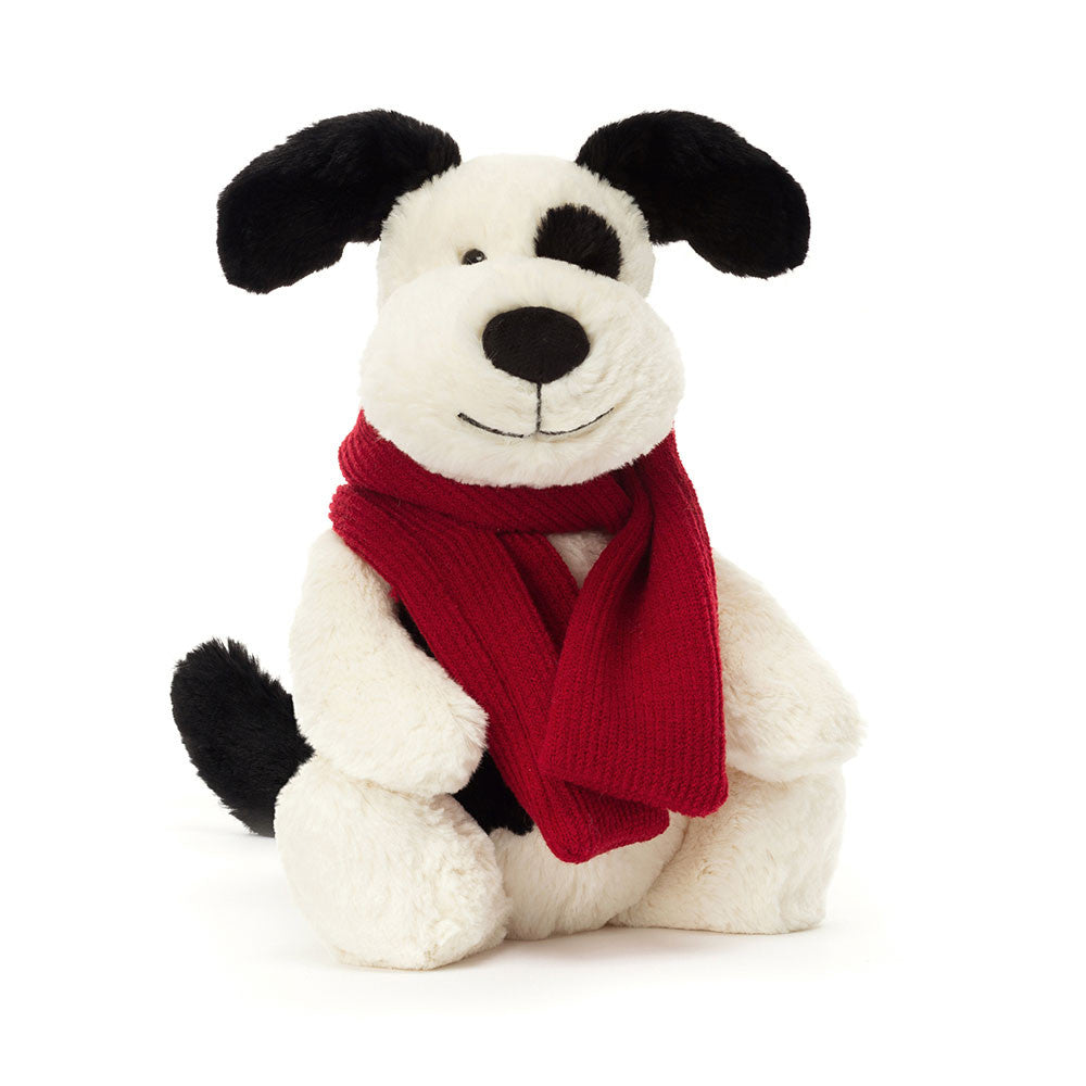 White and black puppy dog plush toy with red knitted scarf 