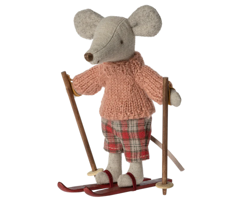 Little stuffed mouse doll wearing pink jumper and red tartan trousers, and red ski 