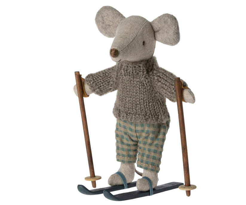 Little stuffed mouse doll wearing grey jumper and green gingham trousers, and ski 