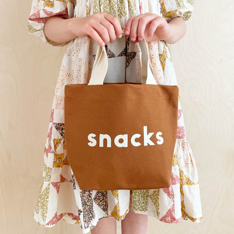 Small brown cotton canvas tote bag with Snacks printed and white handle
