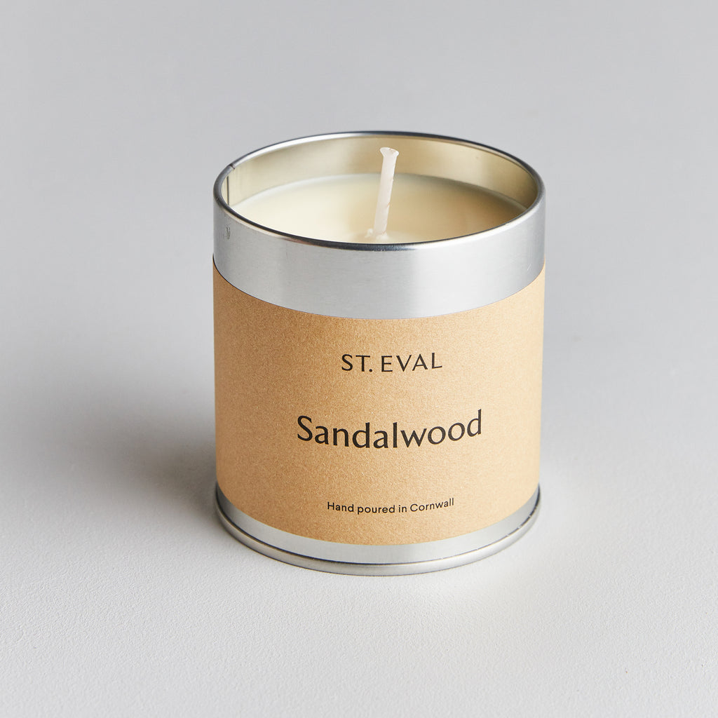 sandalwood scented candle in a silver tin