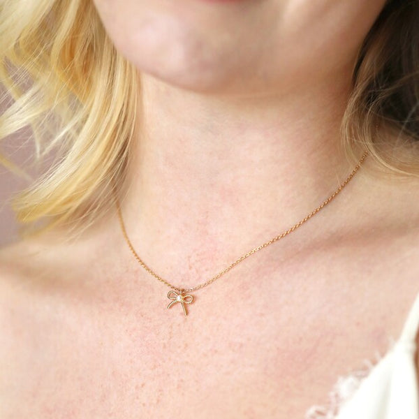 Tiny Pearl Bow Pendant Necklace in Gold