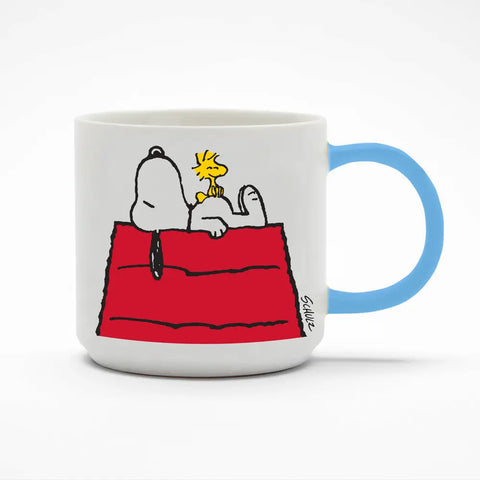 white ceramic mug with snoopy and woodstock on red roof, with blue handle